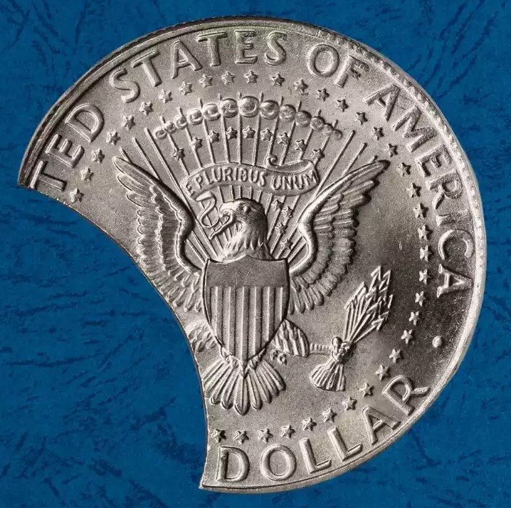 2025 Kennedy Half Dollar clipped planchet error showing crescent-shaped missing metal section on coin edge